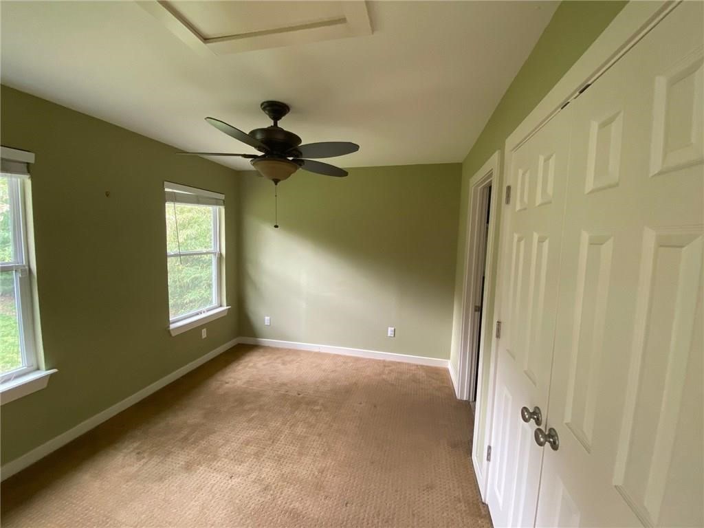 3308 Randolph Road, Unit B Austin, TX 78722 - Photo 13 of 16 a view of a livingroom with a ceiling fan and window