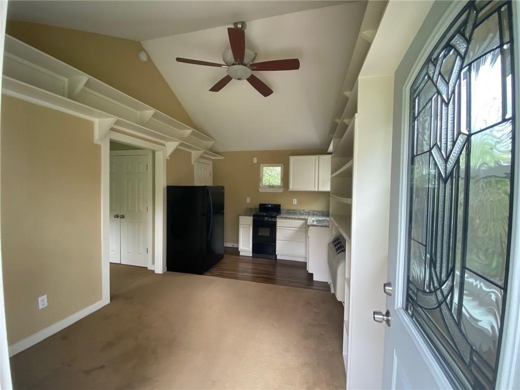 3308 Randolph Road, Unit B Austin, TX 78722 - Photo 2 of 16 a view of a kitchen with a refrigerator and a sink