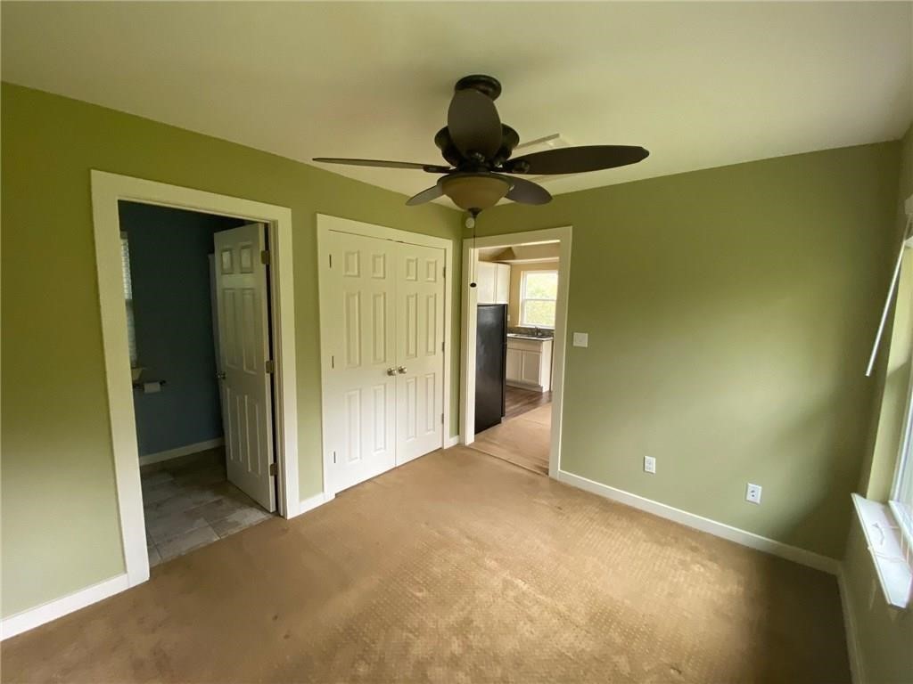 3308 Randolph Road, Unit B Austin, TX 78722 - Photo 9 of 16 a view of a hallway with a chandelier
