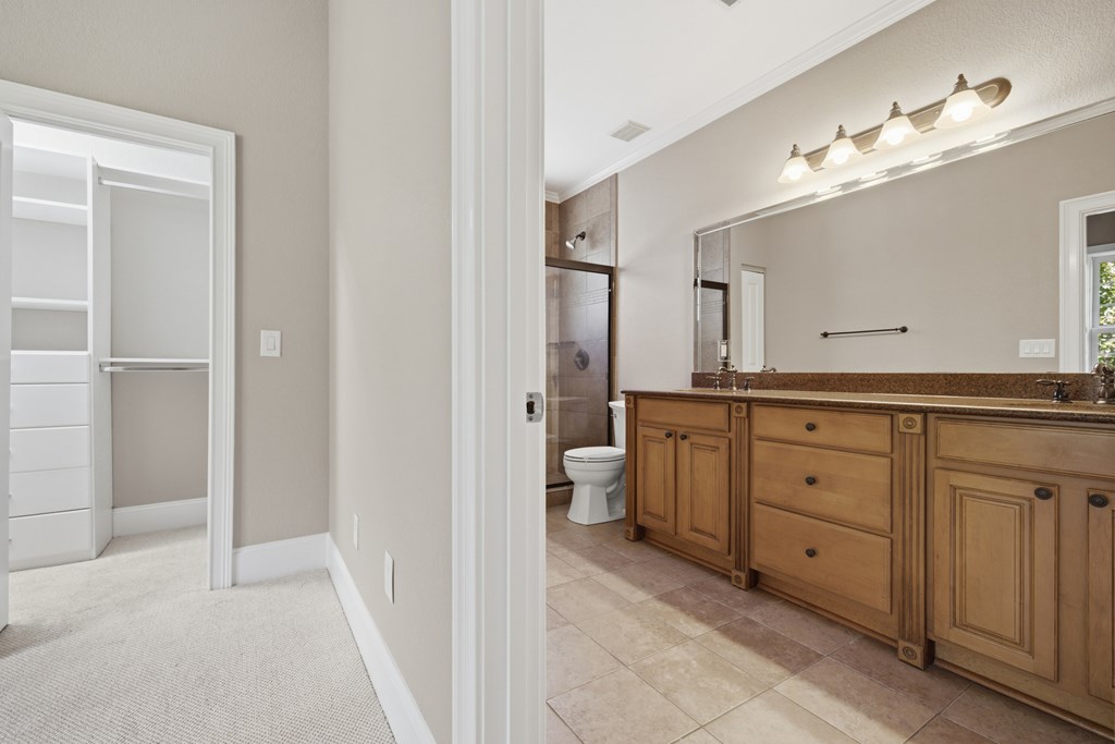 2143 Ridgecrest Circle, Unit 1 Hiawassee, GA 30546 - Photo 36 of 53 a spacious bathroom with a granite countertop sink a toilet and a mirror