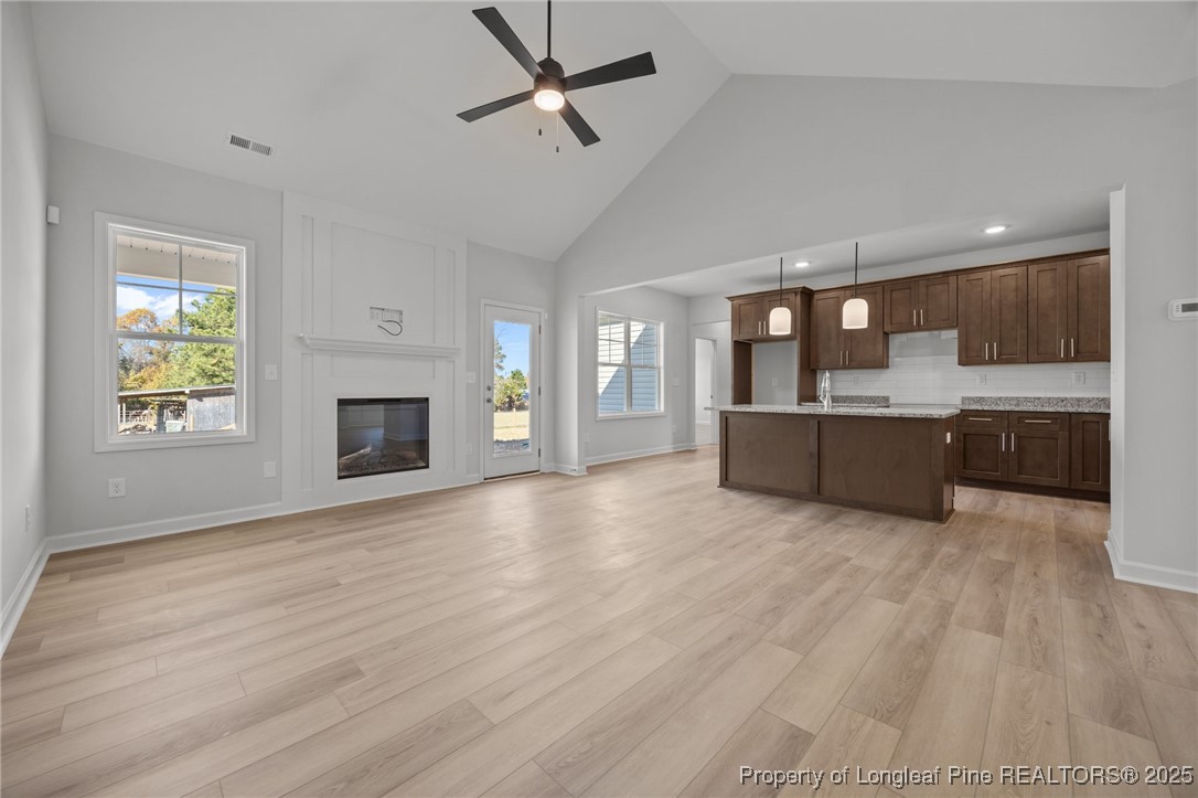 3180 Cameron Hill Road Cameron, NC 28326 - Photo 11 of 46 a view of a kitchen with a sink cabinets and a fireplace