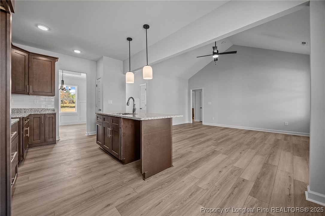 3180 Cameron Hill Road Cameron, NC 28326 - Photo 12 of 46 a view of a kitchen with a sink and wooden floor