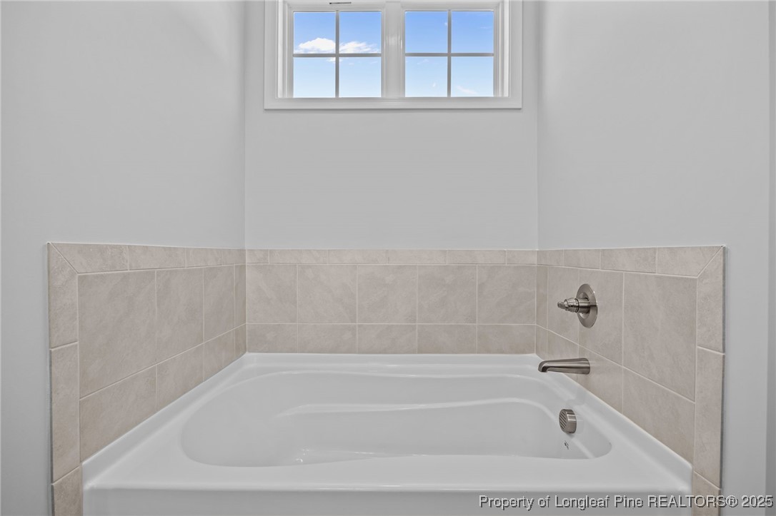 3180 Cameron Hill Road Cameron, NC 28326 - Photo 27 of 46 a close up of a bathtub in a bathroom