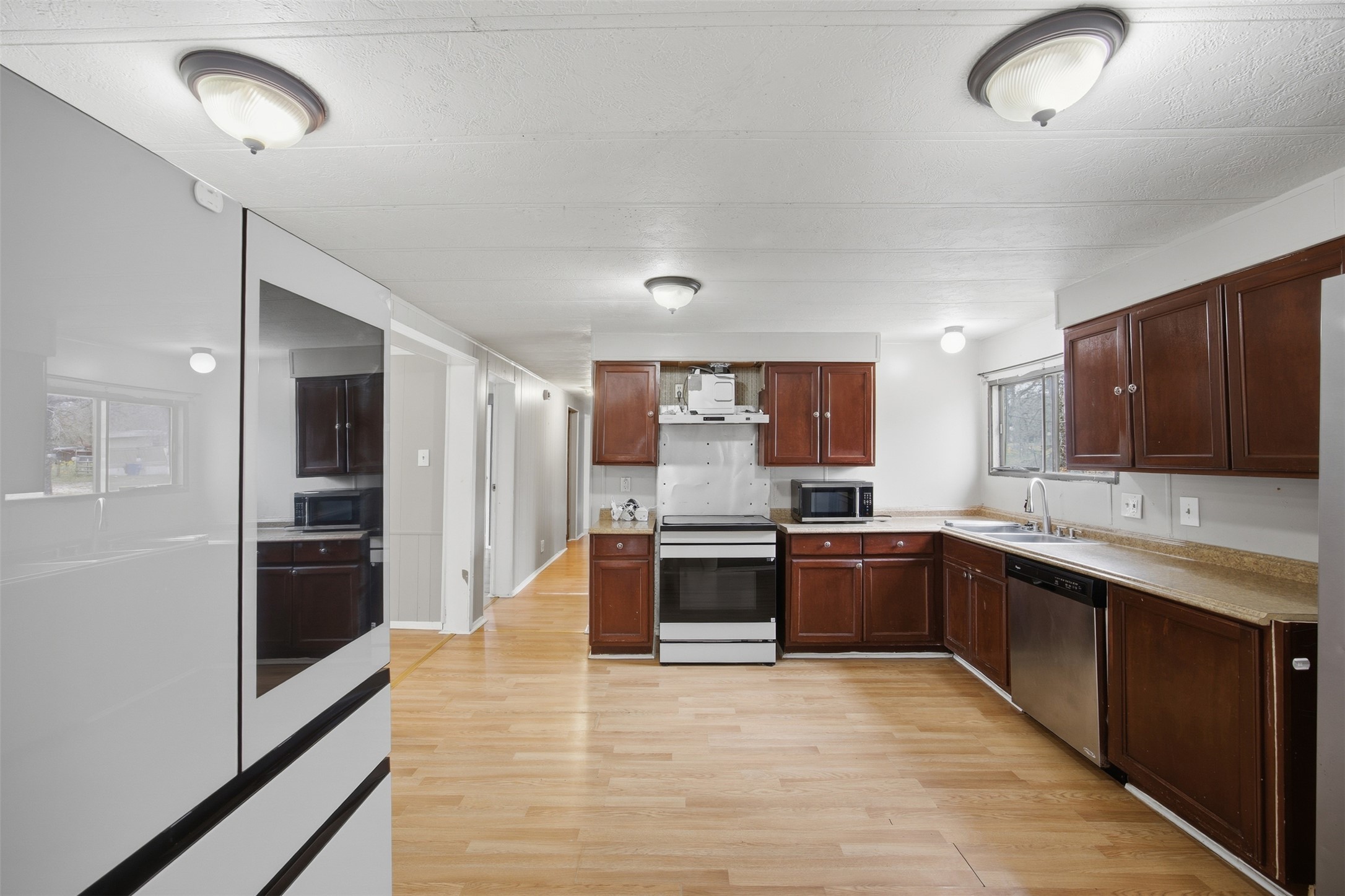840 Oak Tree Road Seguin, TX 78155 - Photo 12 of 37 a large kitchen with stainless steel appliances granite countertop a refrigerator and a stove top oven