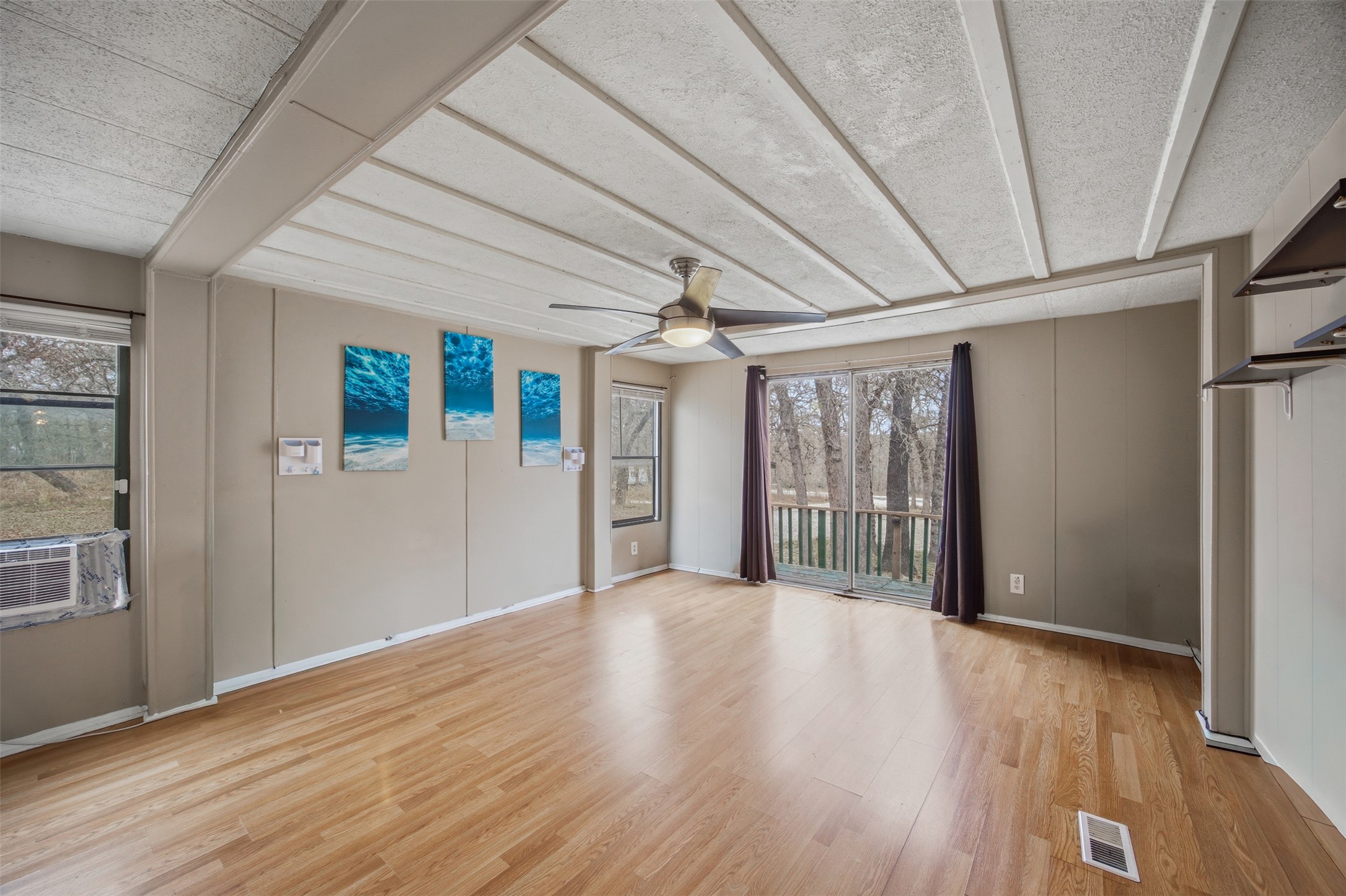 840 Oak Tree Road Seguin, TX 78155 - Photo 15 of 37 a view of an empty room with wooden floor and a window
