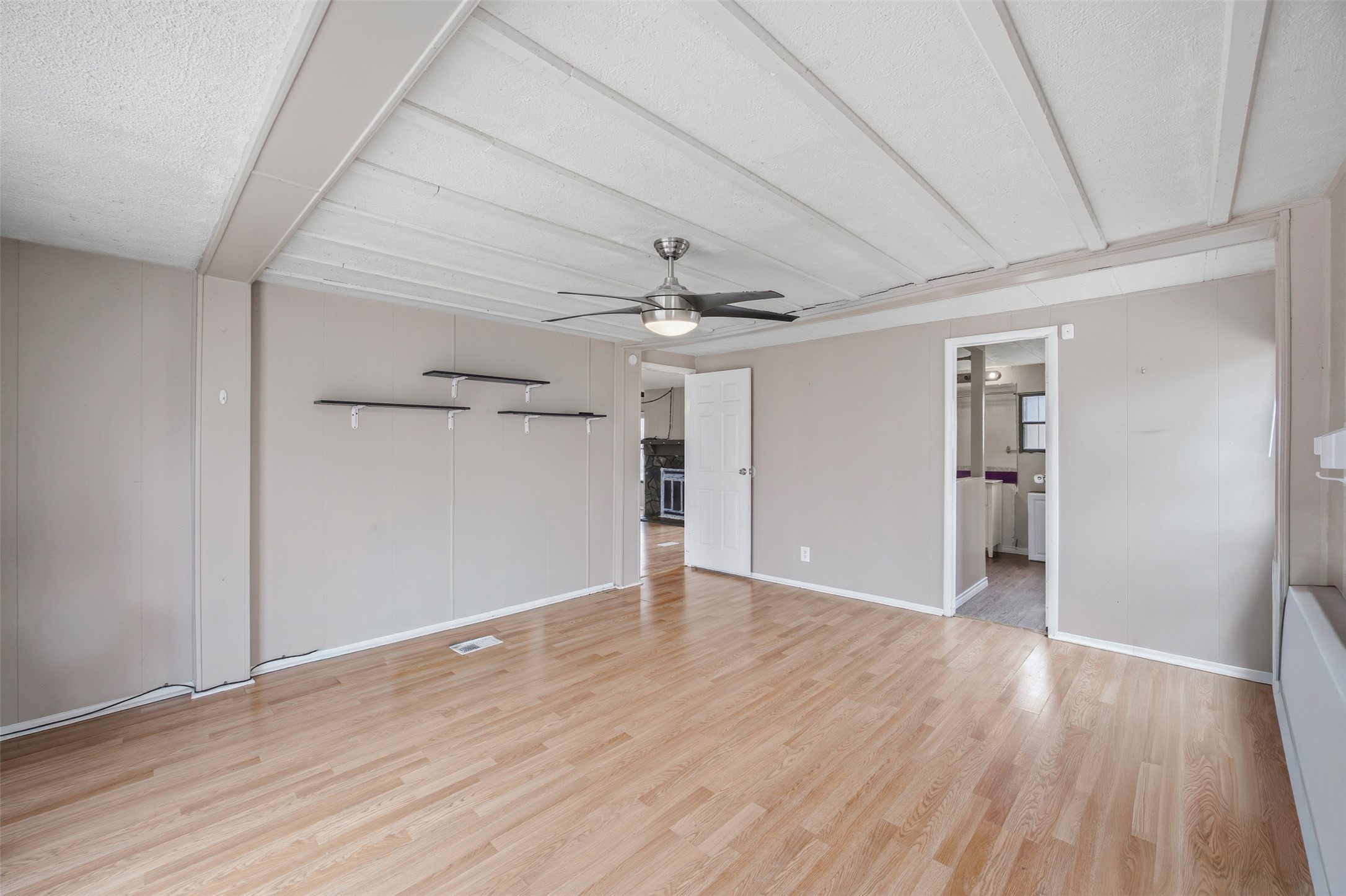 840 Oak Tree Road Seguin, TX 78155 - Photo 16 of 37 wooden floor in an empty room with a window