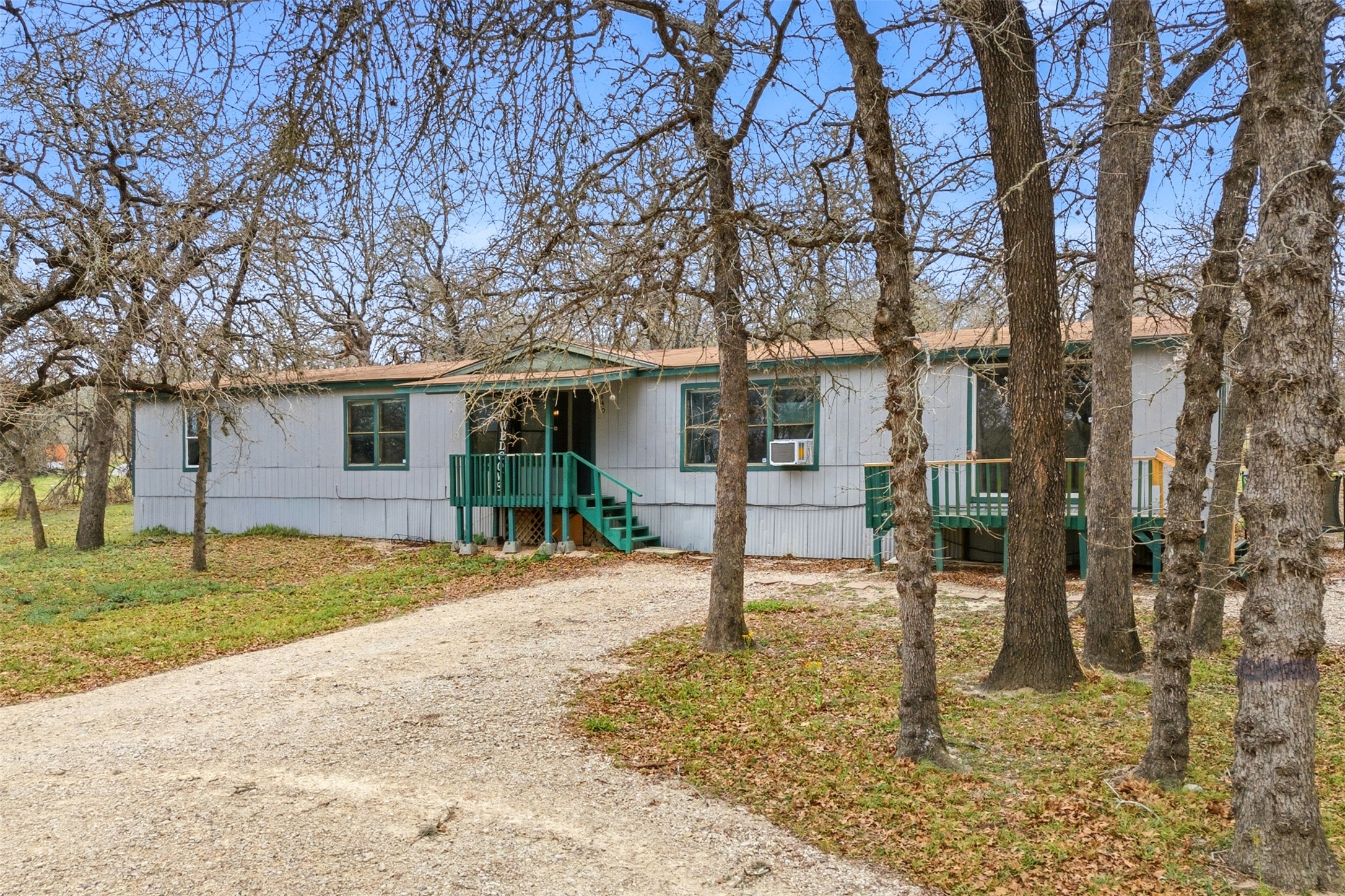 840 Oak Tree Road Seguin, TX 78155 - Photo 2 of 37 a view of a house with a yard and large tree