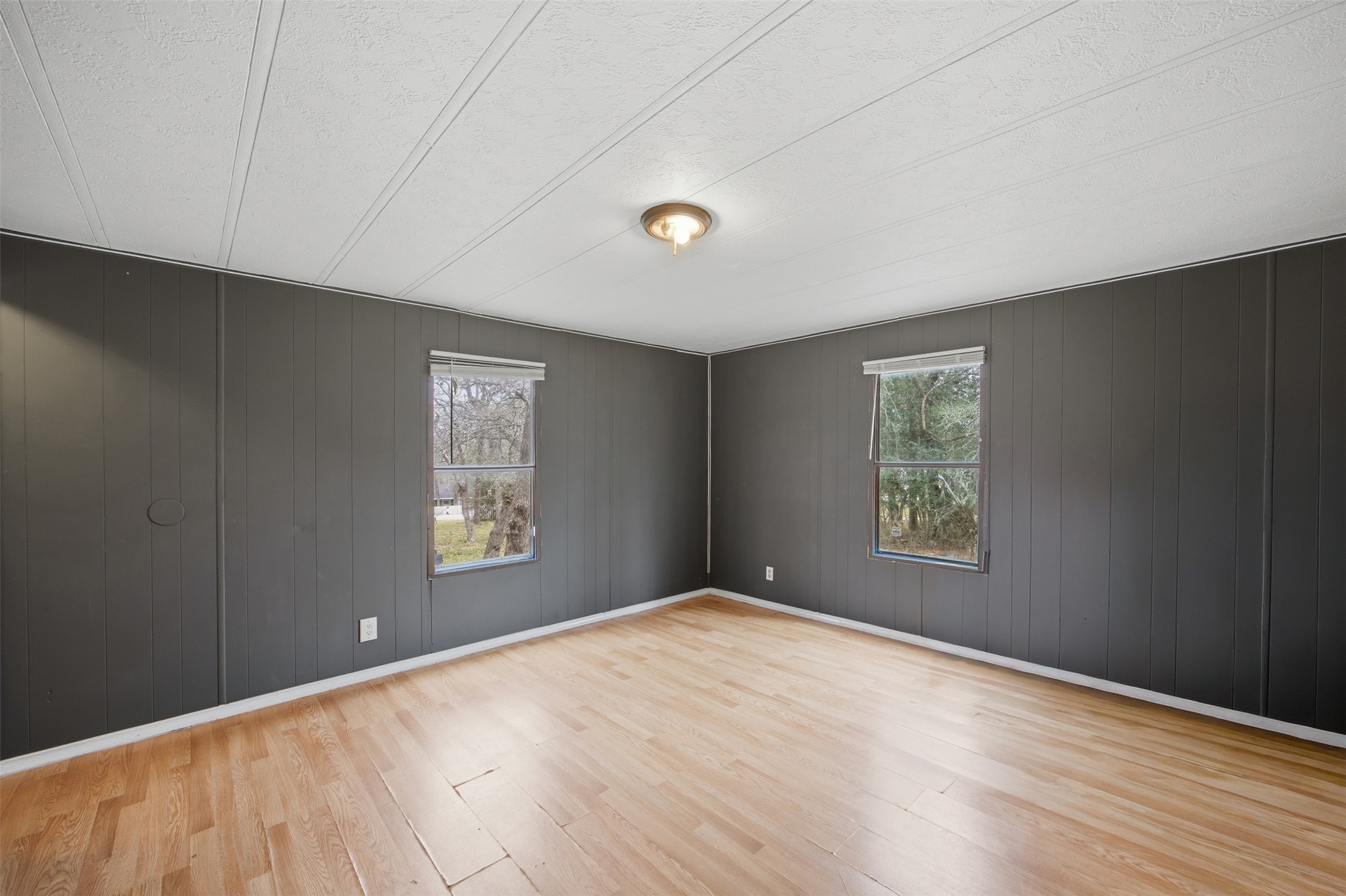 840 Oak Tree Road Seguin, TX 78155 - Photo 23 of 37 a view of an empty room with window and wooden floor