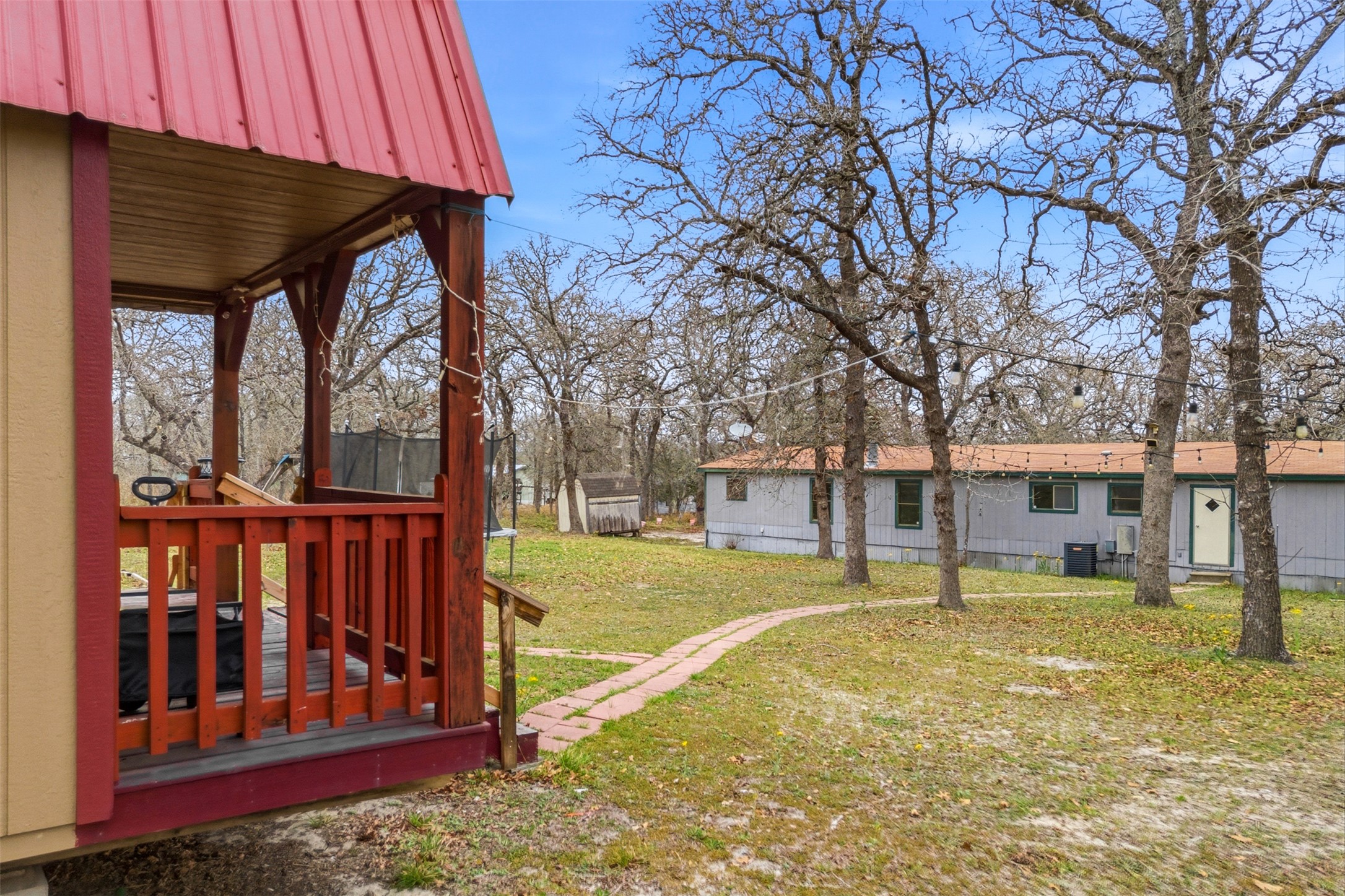 840 Oak Tree Road Seguin, TX 78155 - Photo 32 of 37 a view of a house with backyard and trees