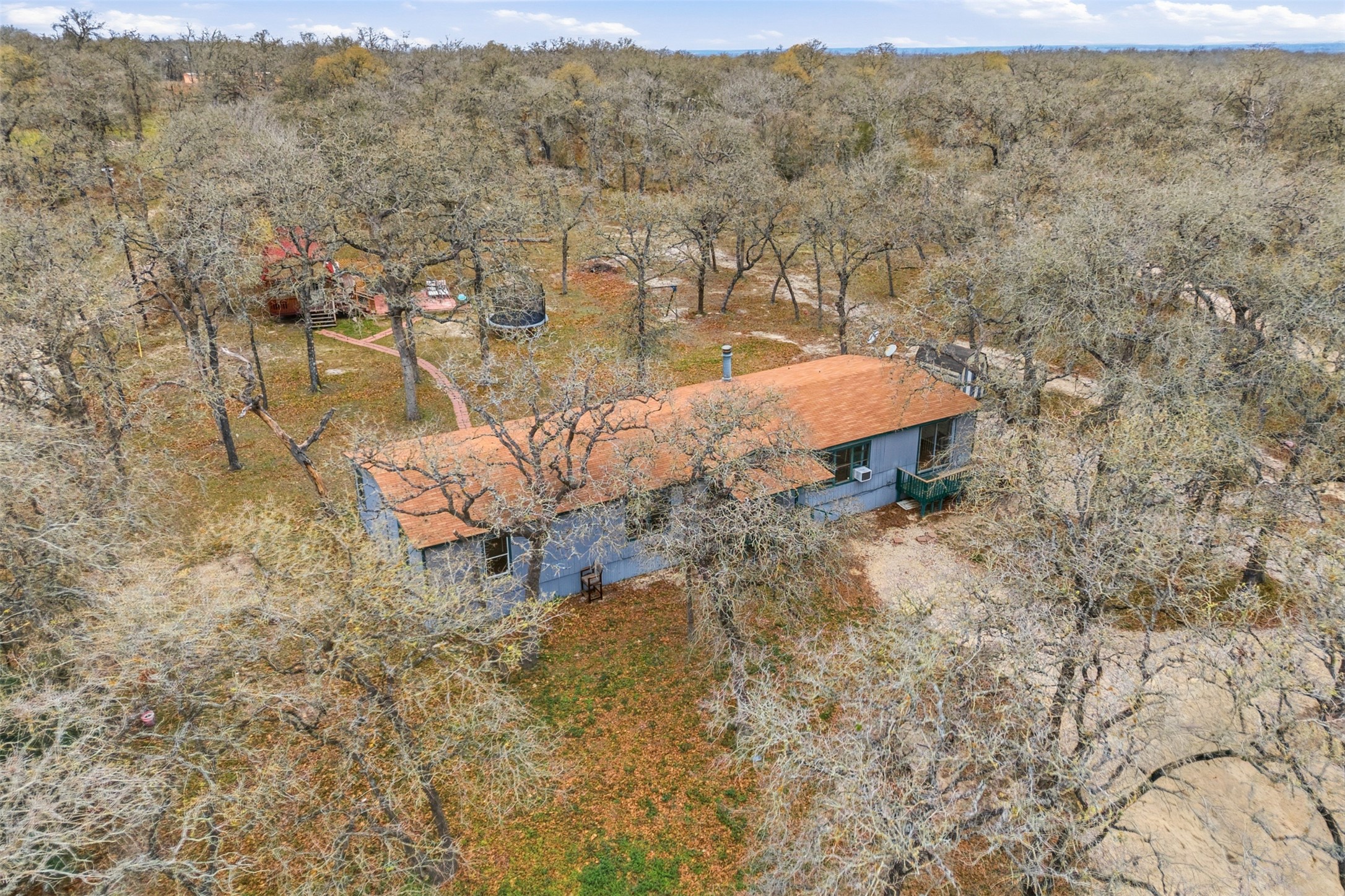840 Oak Tree Road Seguin, TX 78155 - Photo 35 of 37 an aerial view of a house with yard and mountain view