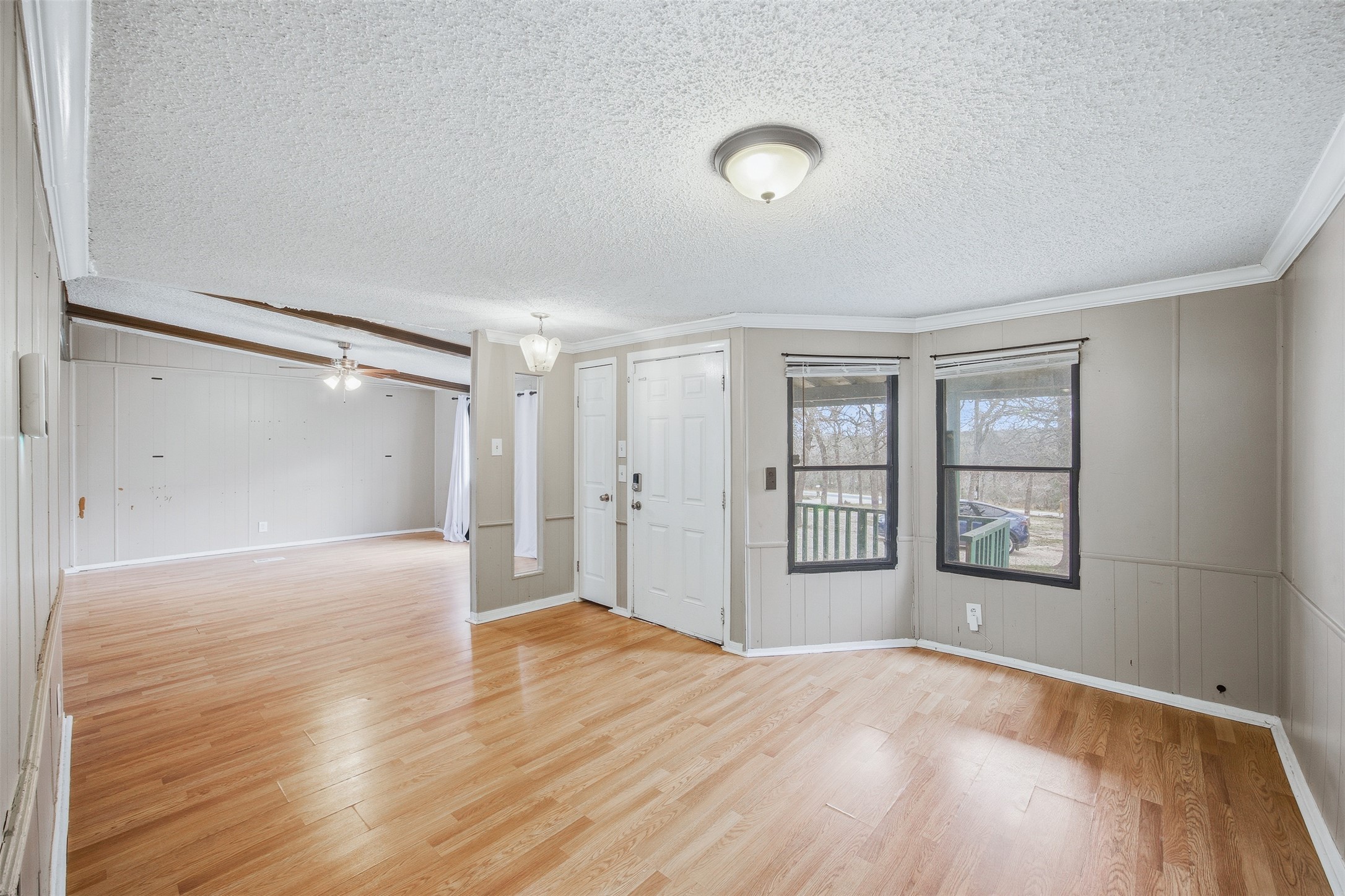 840 Oak Tree Road Seguin, TX 78155 - Photo 7 of 37 a view of an empty room with window and wooden floor