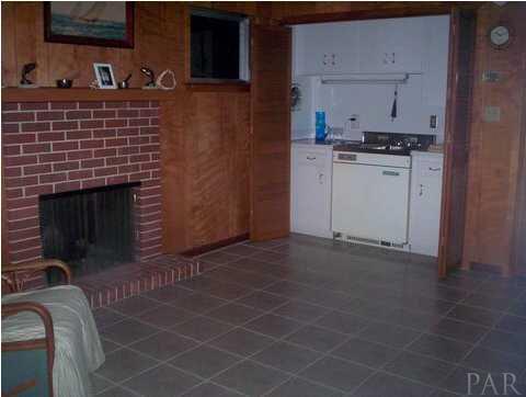1841 Semur Road Pensacola, FL 32503 - Photo 17 of 23 VINTAGE ALERT! Check out the cool 50's mini bar next to cozy brick fireplace. 3 in 1 Sink, burner, fridge by ACME!
