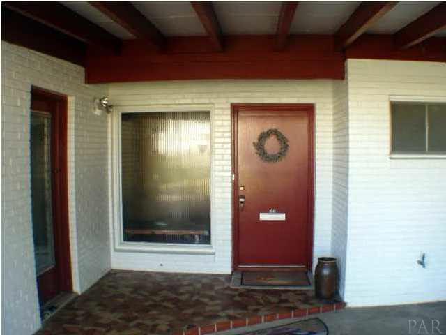 1841 Semur Road Pensacola, FL 32503 - Photo 6 of 23 Entrance, moziac tiles, front door (red). Direct access kitchen door (on left) for easy grocery delivery!