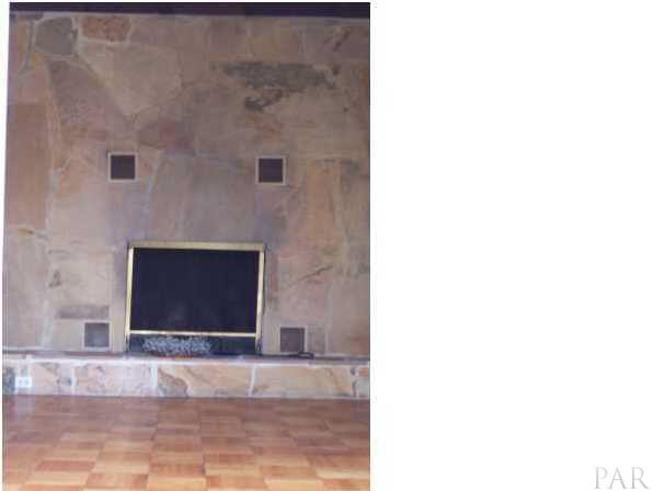 1841 Semur Road Pensacola, FL 32503 - Photo 7 of 23 Wall of slate...floor to ceiling with fireplace! GIANT oversized rock. Rare to see such large slates. They are massive. Truly unique and functions as a privacy barrier from the foyer as well as fireplace.