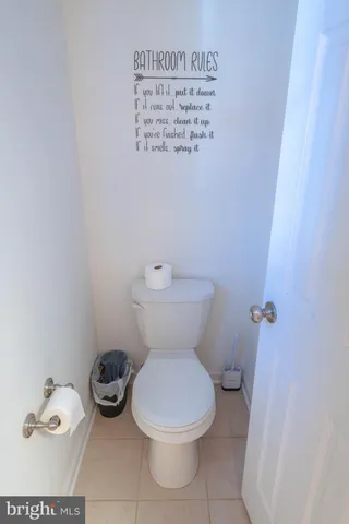 a white toilet sitting next to a bathroom sink