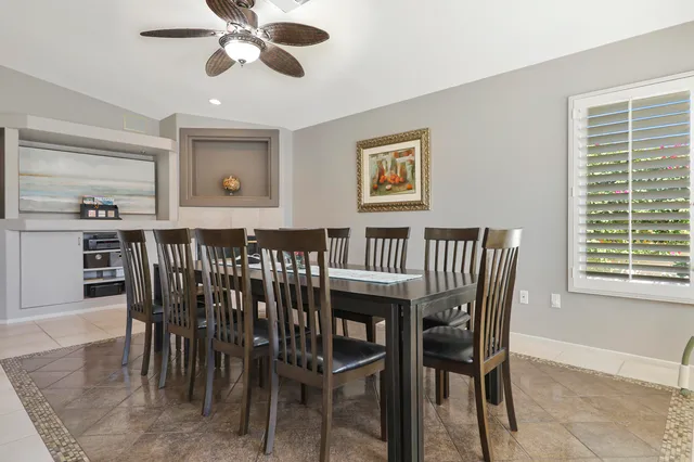 a view of a hallway with a dining room view