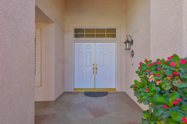 a living room with furniture flat screen tv and a window