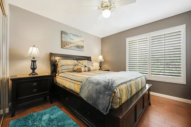 a bathroom with a sink vanity mirror and toilet