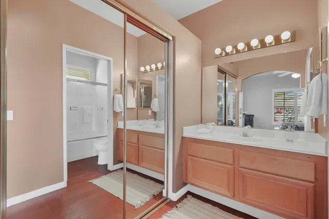 a view of a house with swimming pool and sitting area