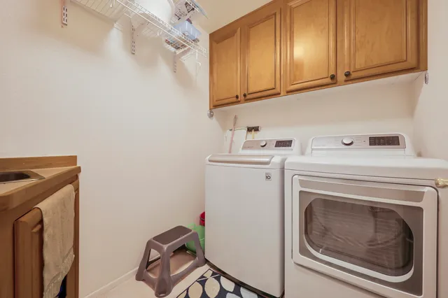 a view of a house with swimming pool yard and a patio
