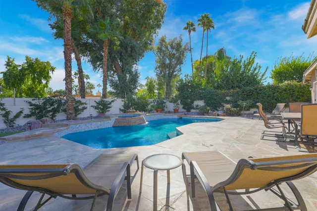 a view of a swimming pool with a patio