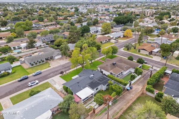 an aerial view of residential houses with outdoor space