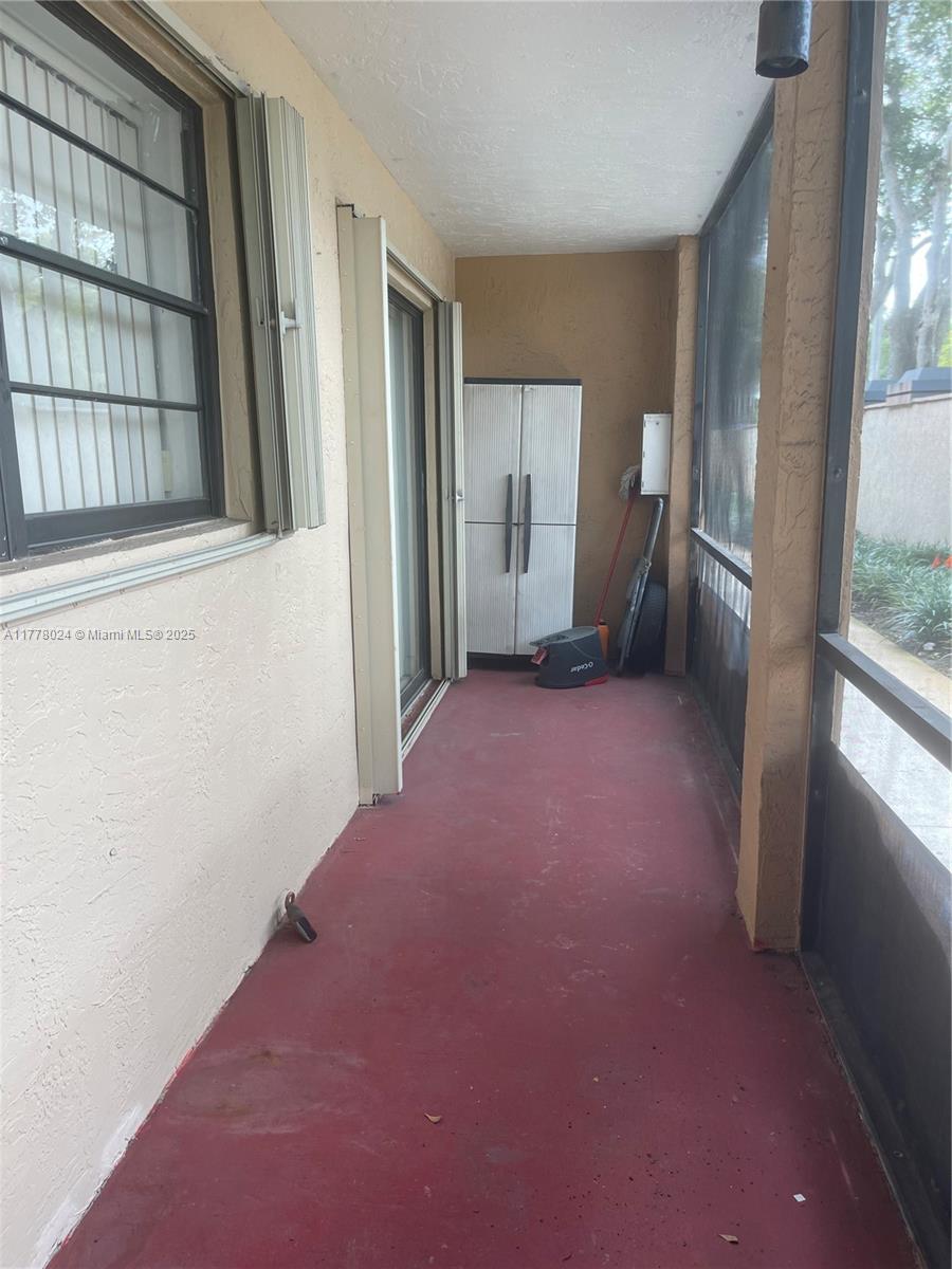 18230 Mediterranean Boulevard, Unit 1302 Hialeah, FL 33015 - Photo 17 of 42 a view of empty room with a fireplace