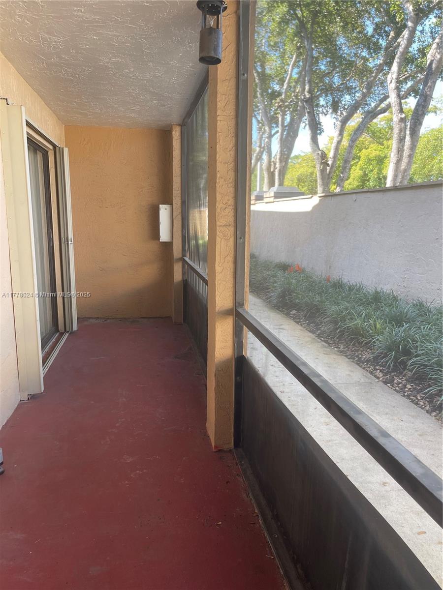 18230 Mediterranean Boulevard, Unit 1302 Hialeah, FL 33015 - Photo 19 of 42 a kitchen view with a refrigerator oven and cabinets