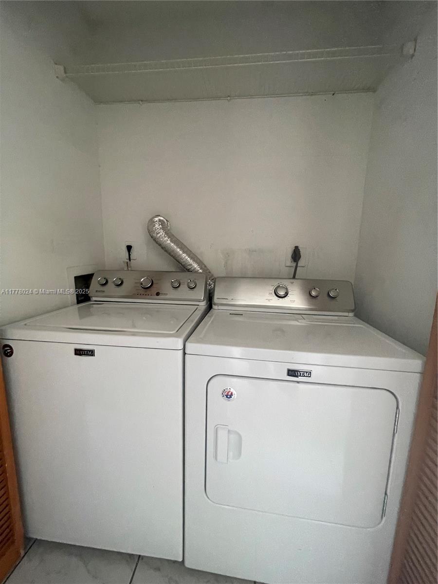 18230 Mediterranean Boulevard, Unit 1302 Hialeah, FL 33015 - Photo 26 of 42 a utility room with dryer and washer