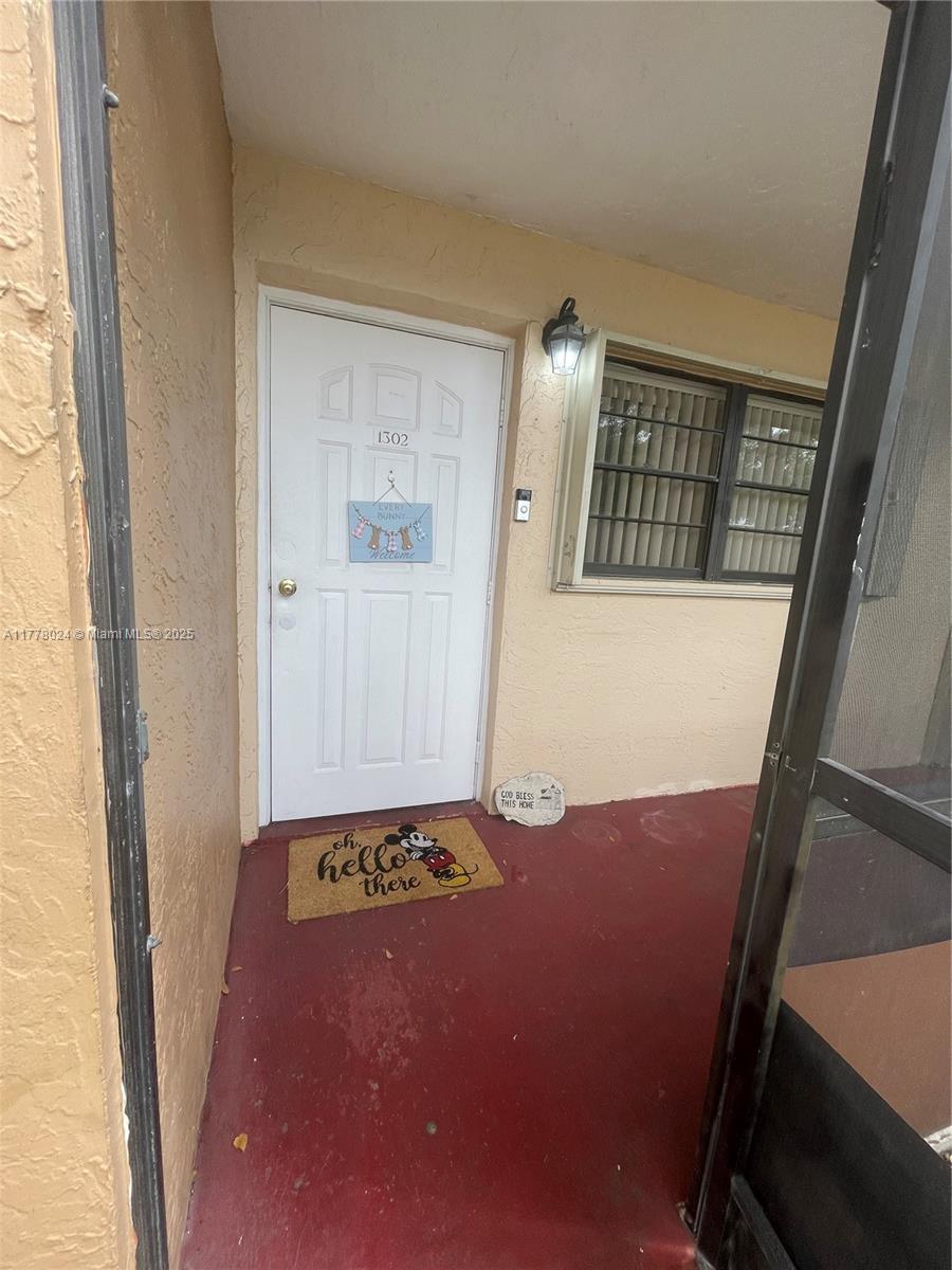 18230 Mediterranean Boulevard, Unit 1302 Hialeah, FL 33015 - Photo 3 of 42 a view of an empty room