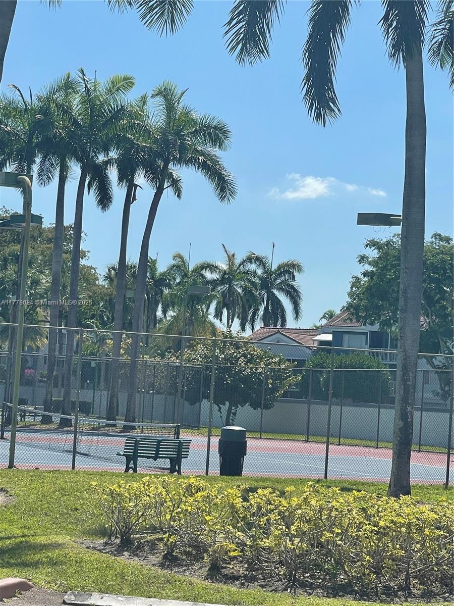18230 Mediterranean Boulevard, Unit 1302 Hialeah, FL 33015 - Photo 31 of 42 a garden view with palm trees