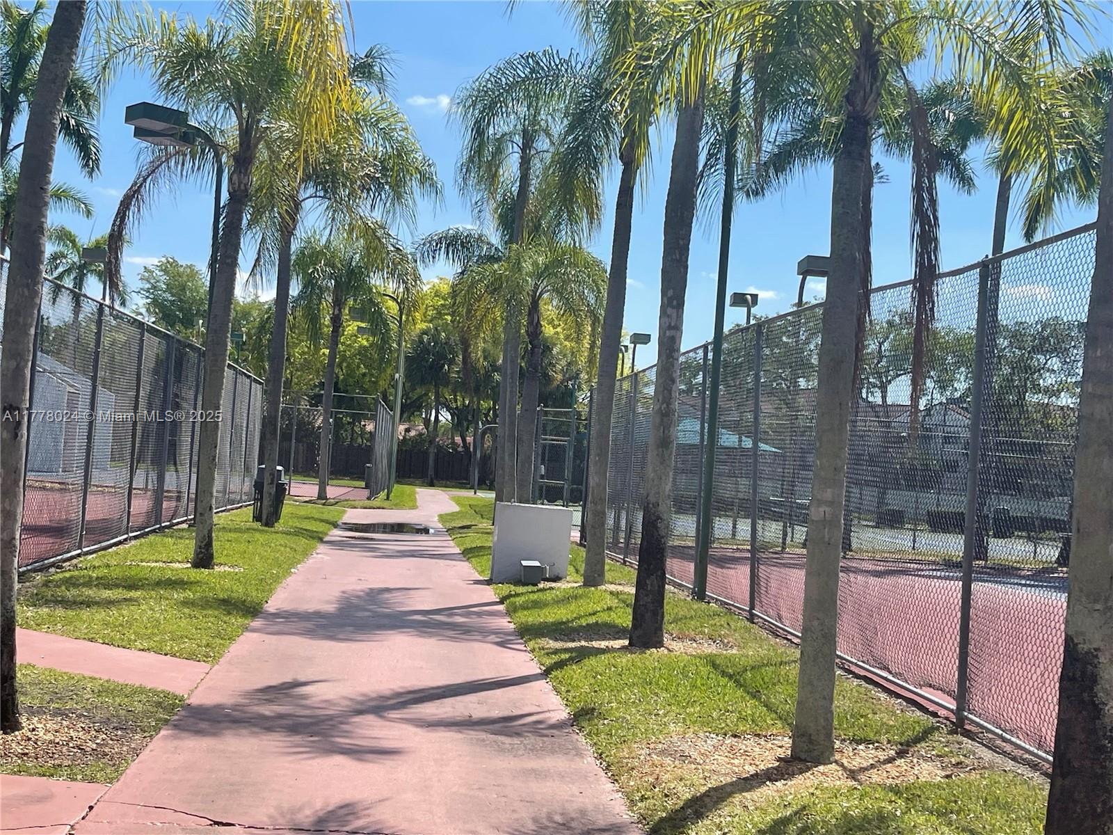 18230 Mediterranean Boulevard, Unit 1302 Hialeah, FL 33015 - Photo 33 of 42 a view of a park with palm trees
