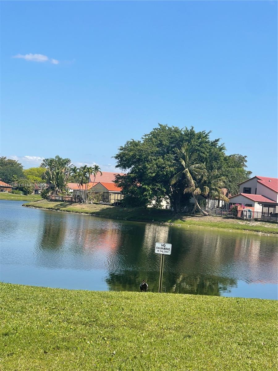 18230 Mediterranean Boulevard, Unit 1302 Hialeah, FL 33015 - Photo 36 of 42 a view of a lake with a city view