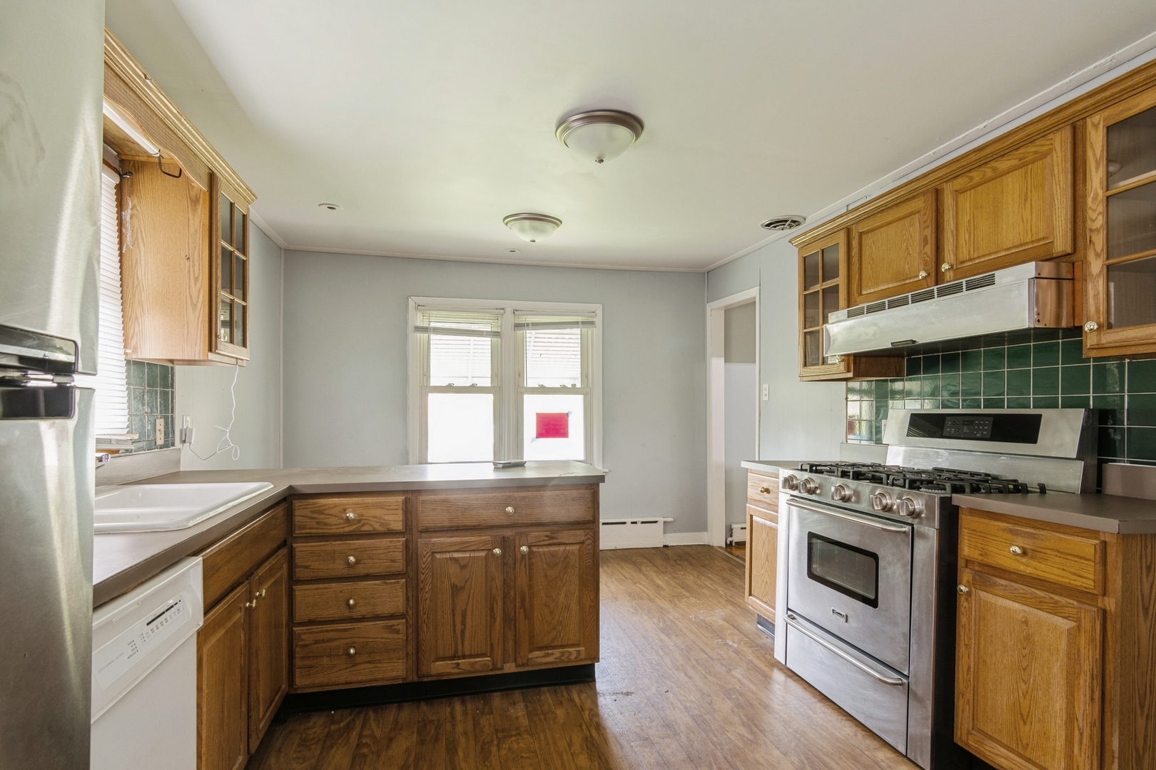 16155 Honore Avenue Markham, IL 60428 - Photo 3 of 10 a kitchen with stainless steel appliances granite countertop a stove and a sink