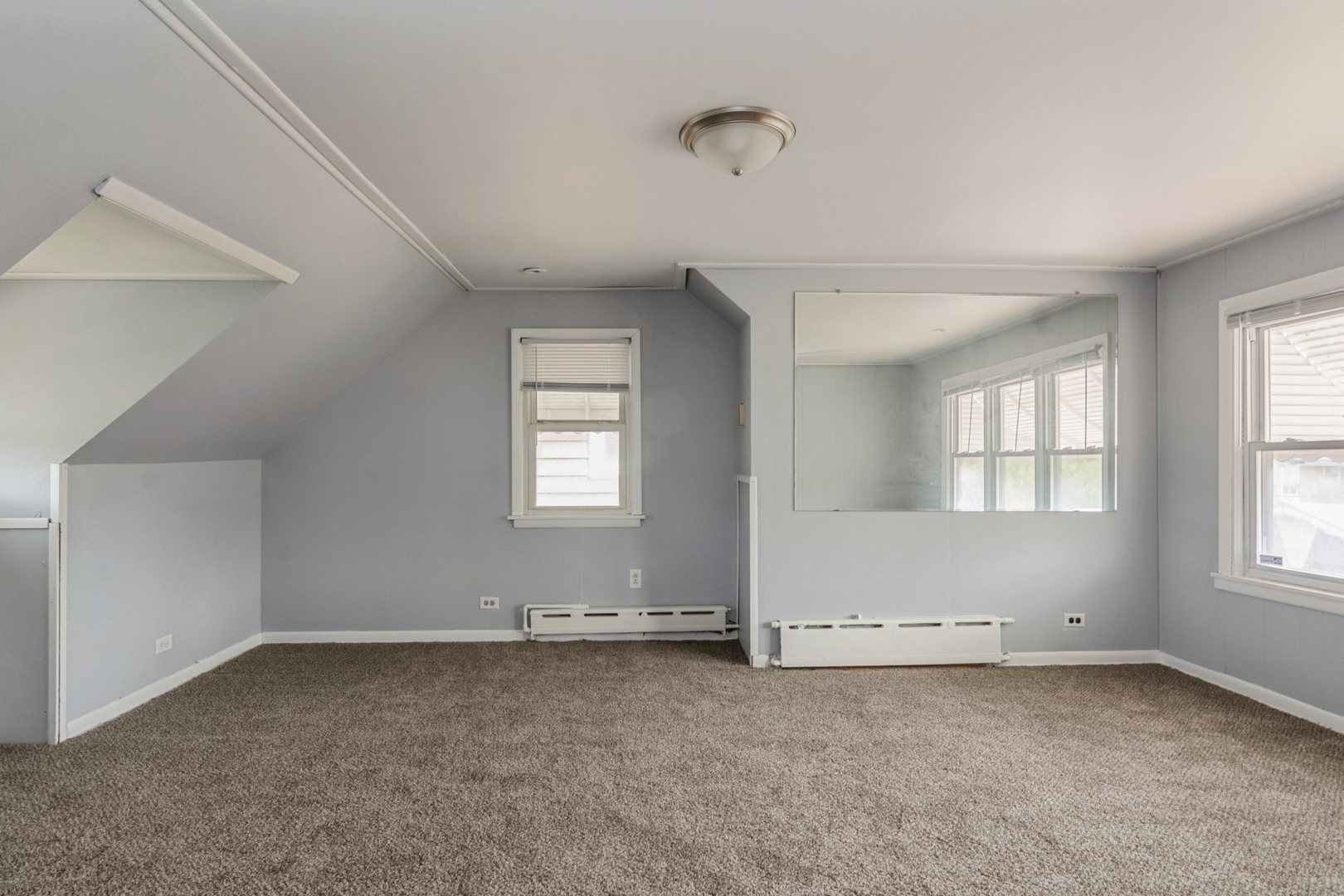 16155 Honore Avenue Markham, IL 60428 - Photo 5 of 10 an empty room with windows