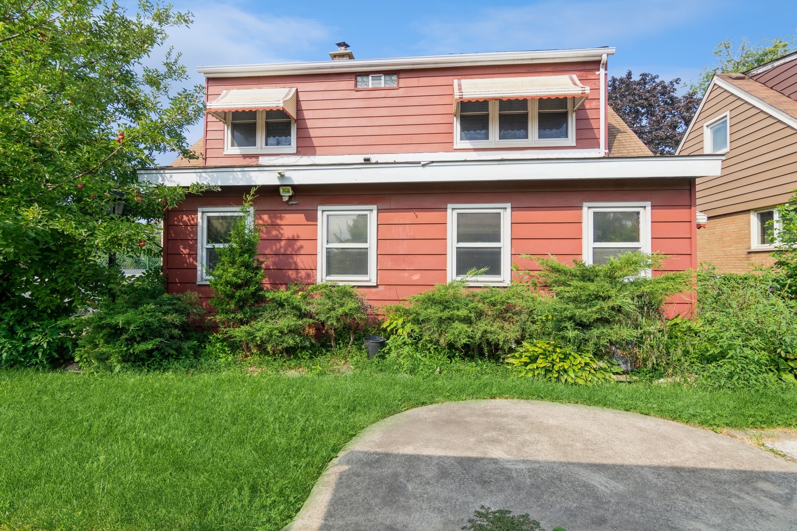 16155 Honore Avenue Markham, IL 60428 - Photo 9 of 10 a view of a house with brick walls and a yard with plants