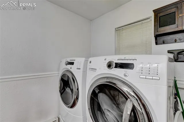 a utility room with dryer and washer