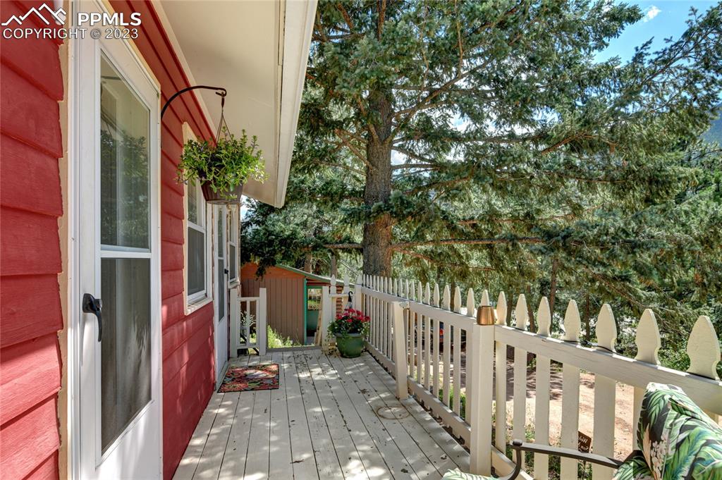 8236 Highway 24 Cascade, CO 80809 - Photo 14 of 24 a view of a house with a yard
