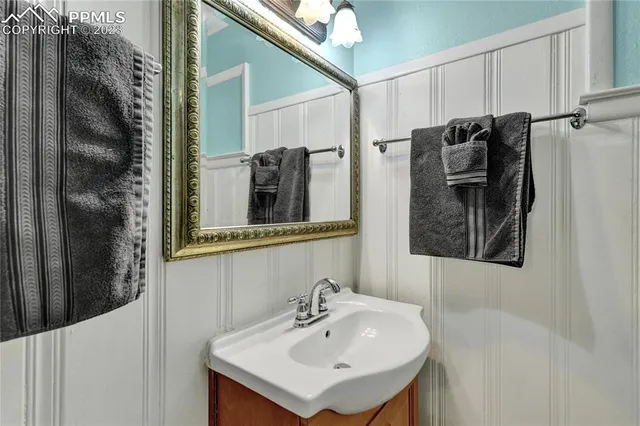 a bathroom with a sink and mirror