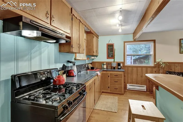 a kitchen with a stove and a refrigerator