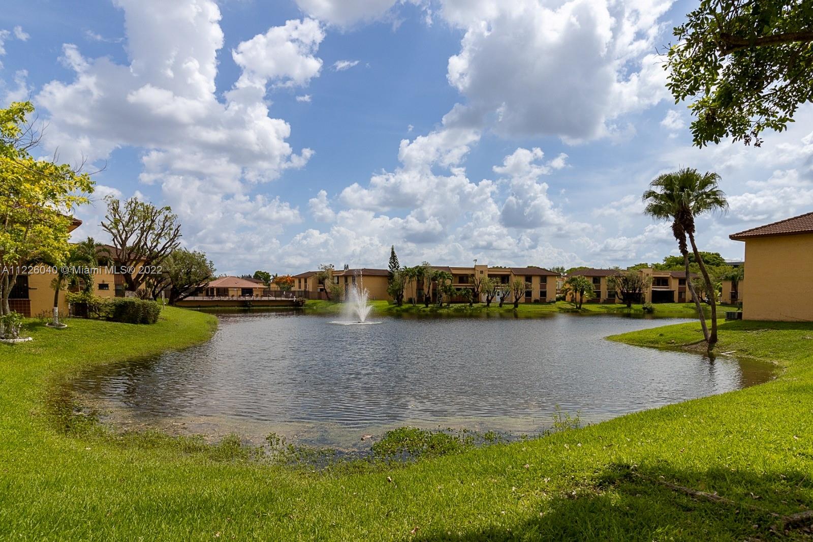 10897 Northwest 7th Street, Unit 1429 Miami, FL 33172 - Photo 15 of 17 a view of a lake with houses in outdoor space