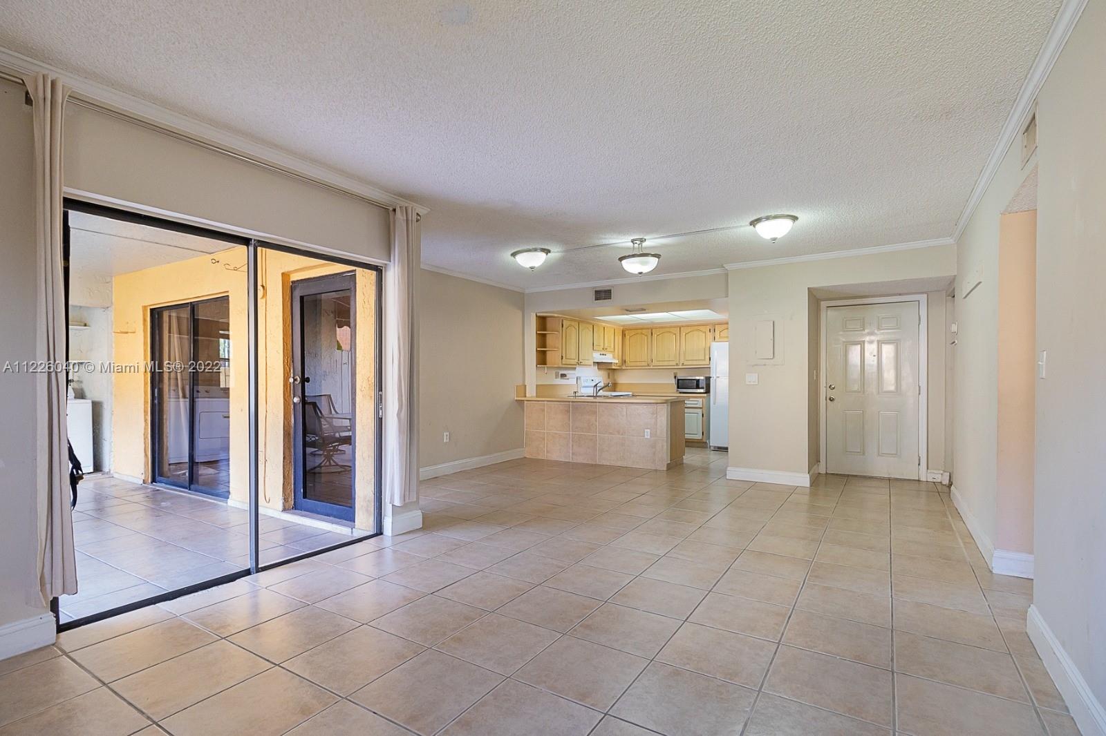 10897 Northwest 7th Street, Unit 1429 Miami, FL 33172 - Photo 4 of 17 a view of a kitchen cabinets and wooden floor kitchen view
