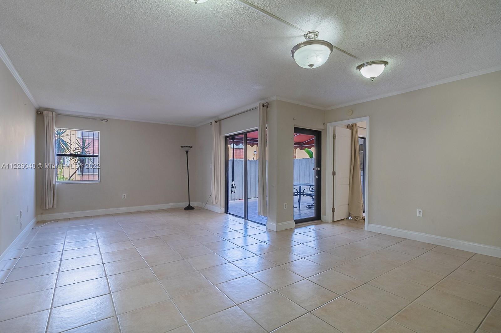 10897 Northwest 7th Street, Unit 1429 Miami, FL 33172 - Photo 5 of 17 a view of livingroom with an empty space and window