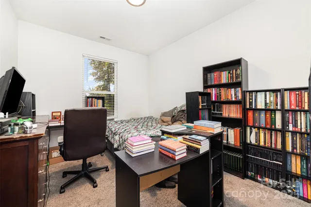 a view of a workspace with furniture