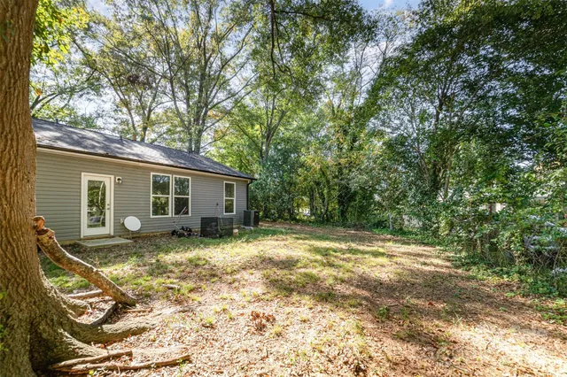 a view of a yard with a tree