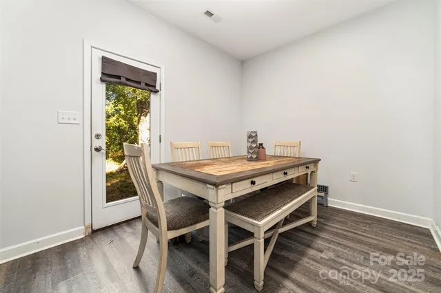 a dining room with a table and chairs