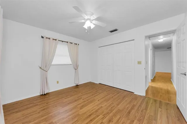 a view of residential house with outdoor space and lake