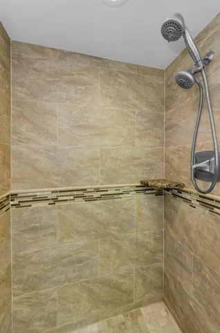 a view of a garden with lawn chairs and a fire pit