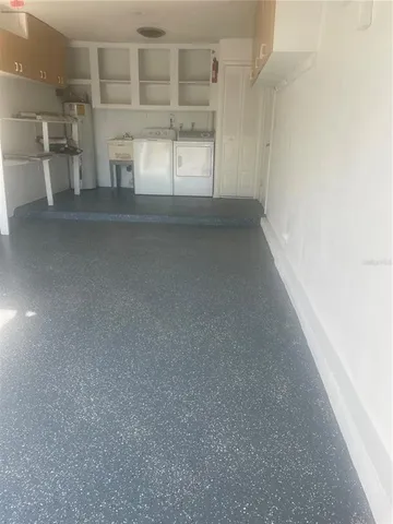 a view of a swimming pool and an entryway