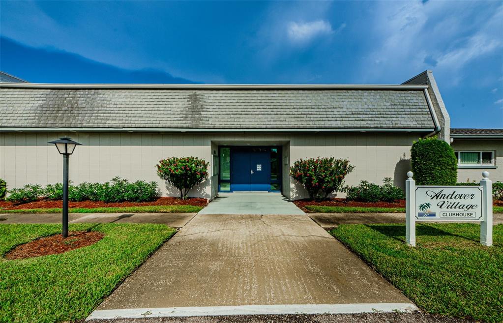 2836 Highlands Boulevard, Unit A Palm Harbor, FL 34684 - Photo 37 of 95 a front view of a house with a yard